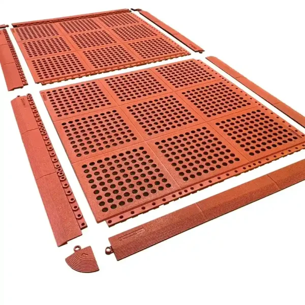 Six large Interlocking Catering Mat tiles in red with matching edge and corner pieces are spread out on a white background.