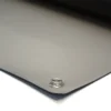 A close-up of Conductive Rubber Bench Matting shows its smooth, dark surface with a metal eyelet in one corner, resting on a white background.