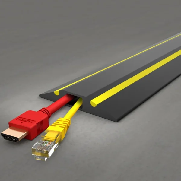 A PVC Cable Protector (GP) in black and yellow covers a red HDMI cable and a yellow Ethernet cable on a grey surface.