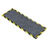 The Cable Protector Mat is a rectangular anti-slip floor mat with a textured grey surface and yellow-and-black striped edges, designed for safety and cable protection.