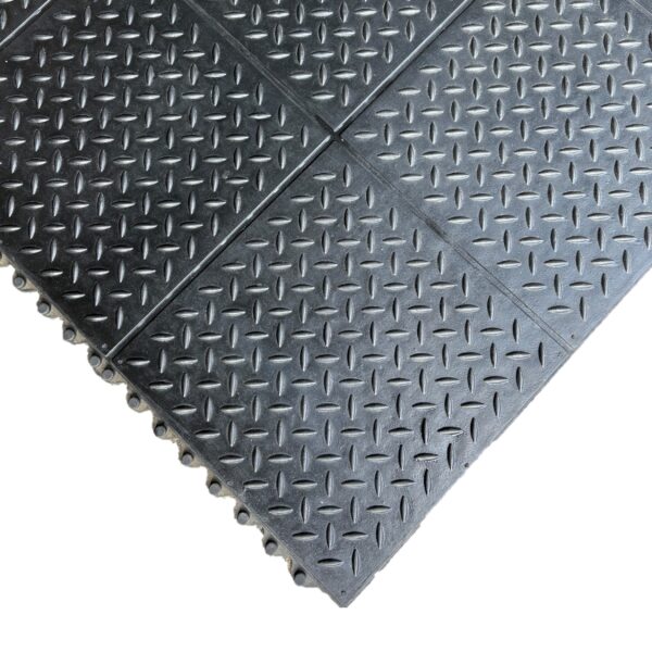 Interlocking Chequer Plate Gym Mat features black rubber tiles with a raised diamond plate pattern. Tiles are partially connected, and the textured surface improves grip and slip resistance.