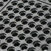 Close-up of the Interlocking Anti-Fatigue Mat, featuring a rugged black rubber surface with repeating hexagonal holes for durability and slip resistance, ideal for industrial or entrance use.