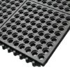 A close-up view of the Interlocking Anti-Fatigue Mat, featuring black rubber construction with a honeycomb pattern of hexagonal holes and interlocking edges.