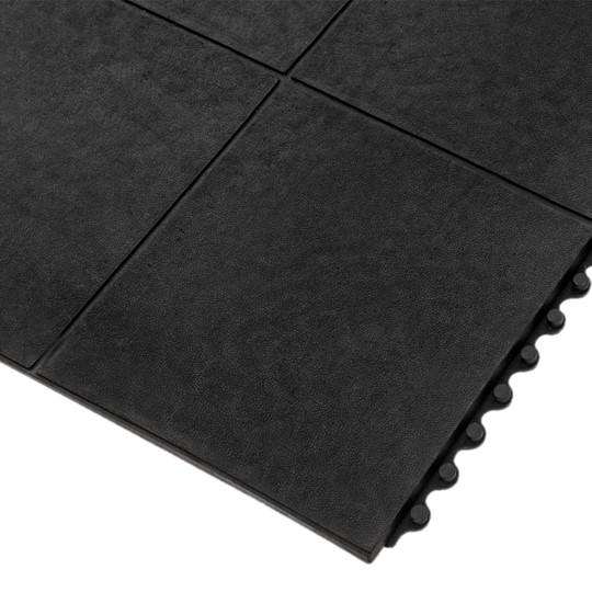 Close-up of Interlocking Solid Top Gym Mat tiles featuring a smooth, matte black surface and rounded edges for easy assembly—ideal for gyms, playrooms, and other high-traffic areas.
