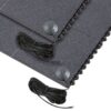 Close-up of two Interlocking Solid Top Gym Mats with textured black surfaces, each featuring a long power lead and round control button, stacked one on top of the other.