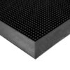 Close-up of the Flexible Bristle Mat's corner, showing its black textured surface with raised circular bumps and a bevelled edge.