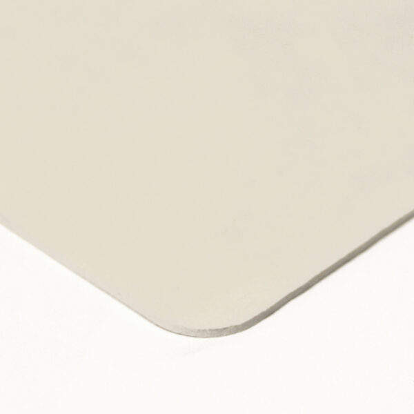 A close-up of the rounded corner of a thin, rectangular Food Quality Rubber Sheet in a light colour, set against a white background.