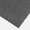 A close-up of the Anti-Slip Flat Sheet, a rectangular black foam sheet with a textured surface, displayed against a white background.