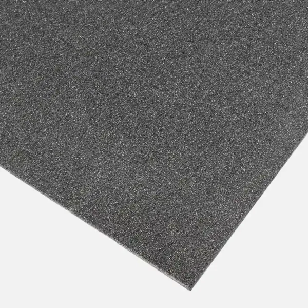 A close-up of the Anti-Slip Flat Sheet, a rectangular black foam sheet with a textured surface, displayed against a white background.
