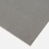 Close-up view of the Anti-Slip Flat Sheet, a rectangular grey sheet with a textured, gritty surface shown against a white background.