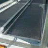 Close-up view of the Anti-Slip Flat Sheet, featuring a textured black surface with metal edges and rails—ideal for use on ramps or platforms in vehicle or equipment loading areas.