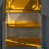Sunlight brightens three yellow Anti-Slip Flat Sheets inside a vehicle, casting shadows and highlighting their clean, vibrant surfaces. The scene feels warm and peaceful.