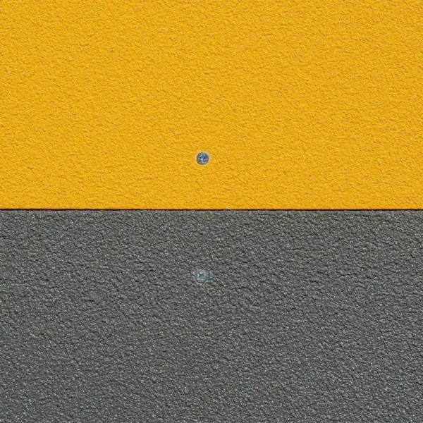 An Anti-Slip Flat Sheet on a textured wall is split horizontally: yellow on top, grey below. Each section features a single central visible screw.