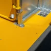 Close-up of the Anti-Slip Flat Sheet in bright yellow, featuring a metal post, spring mechanism, and recessed latch—ideal for industrial use in vehicle interiors or equipment compartments.