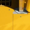 A close-up of the Anti-Slip Flat Sheet shows its bright yellow, textured metal surface with a silver pole and yellow guard rail attached by visible screws. Shadows accentuate the finish.