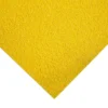 A close-up view of the Anti-Slip Sheet’s rough, grainy yellow surface shown at an angle, with the bottom left corner pointing down—resembling sandpaper or a non-slip mat.