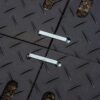 Two 2-Way Connectors secure black, textured interlocking panels with a chequer plate pattern, positioned on a gravel surface.