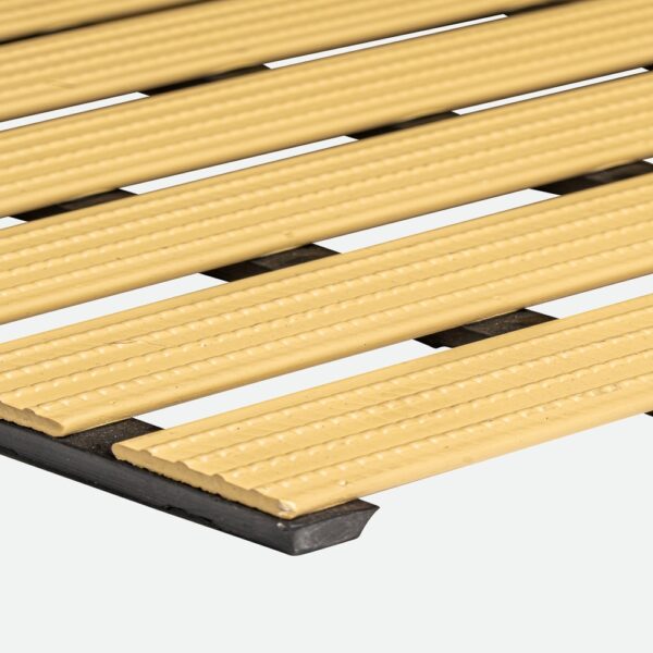Close-up of the Cross-Ribbed PVC Leisure Mat in beige, featuring textured, ribbed slats evenly spaced on a black metal frame, shown at an angle against a plain white background.