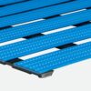 Close-up of blue Cross-Ribbed PVC Leisure Mat, featuring textured plastic slats arranged in parallel rows on a black base, displayed against a light background.