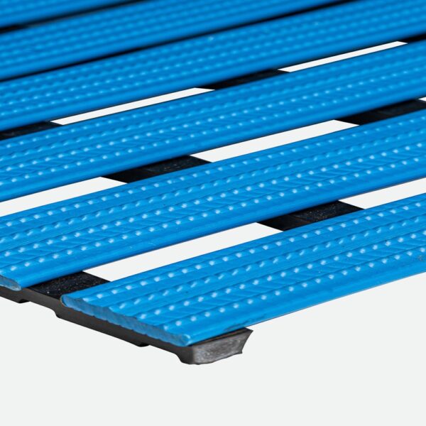 Close-up of blue Cross-Ribbed PVC Leisure Mat, featuring textured plastic slats arranged in parallel rows on a black base, displayed against a light background.