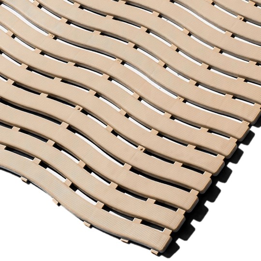 Close-up of Swimming Pool Mat interlocking beige plastic floor tiles with a wavy textured surface, arranged diagonally on a white background.
