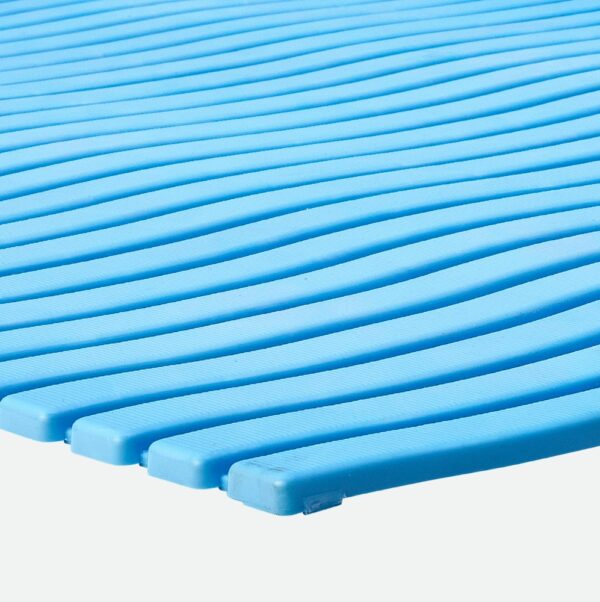 Close-up of several blue Swimming Pool Mat strips arranged in parallel rows with gentle curves, forming a wavy pattern against a white background.
