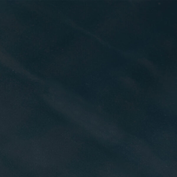A close-up view of Smooth Commercial Rubber Matting, featuring a smooth, dark surface with subtle lighter streaks that resemble black or dark grey marble or stone.