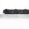 A Grass Mat Roll (1m x 10m x 22mm) in black with a textured finish rests on a rough, light grey concrete surface showing cracks and scratches, set against a white background.