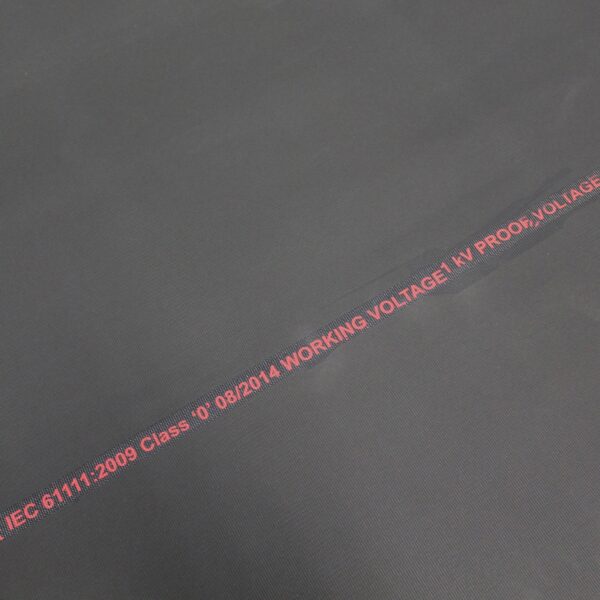 A close-up of Electrical Safety Matting in black, featuring red text: IEC 61111:2009 Class 0; 08/2014, WORKING VOLTAGE 1kV, PROOF VOLTAGE.