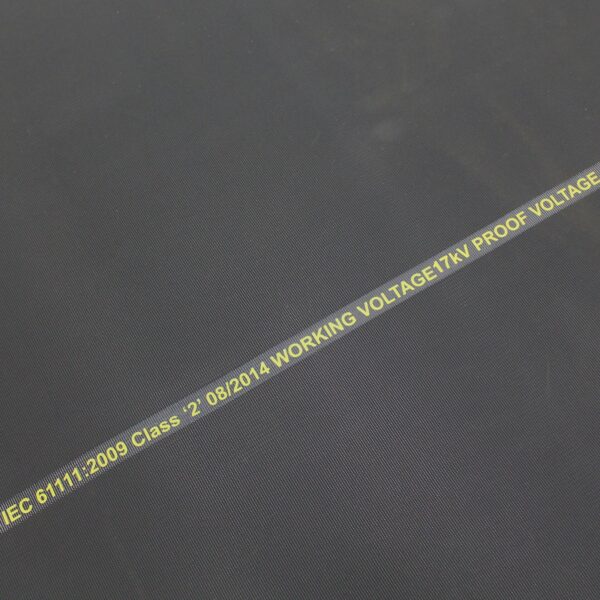 Close-up of Electrical Safety Matting in black with yellow text: IEC 61111:2009 Class - 2, date 08/2014, WORKING VOLTAGE 17kV, PROOF VOLTAGE.