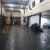 Solid top gym mat.1 scaled compressed|Cushion Link Solid Top Gym Mat 100 Nitrile|clstgp s|Cushion Link Bevels|Solid top gym mat in use at a gym|Solid top gym mat in use at a gym