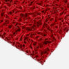 Close-up of the corner of a red Heavy-Duty PVC Vinyl Roll doormat, featuring a textured, tangled looped plastic design on a white background.