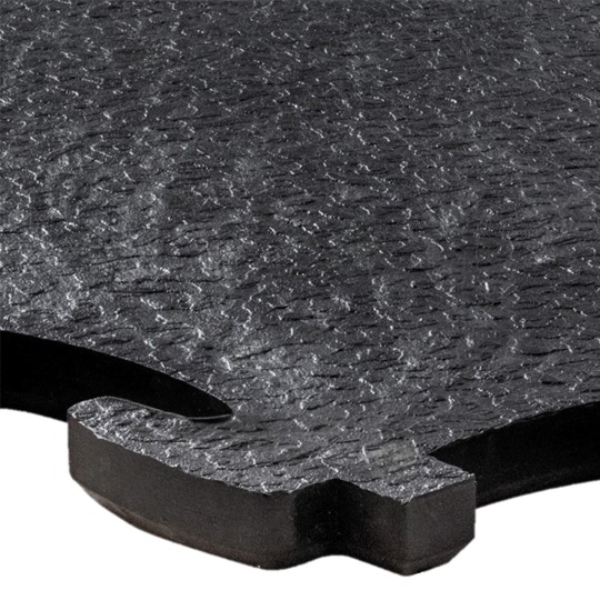 Close-up of a Heavy-Duty Interlocking Tile in black, featuring a textured surface and jigsaw-like edges for connecting with adjacent tiles.