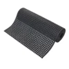The Drainage Workplace Mat is a black rubber mat rolled out with evenly spaced circular holes across its surface.