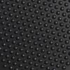 Close-up of the Interlocking Bubble Top Stable Mat’s black textured surface featuring evenly spaced, raised round bumps that catch the light, creating subtle highlights and shadows.