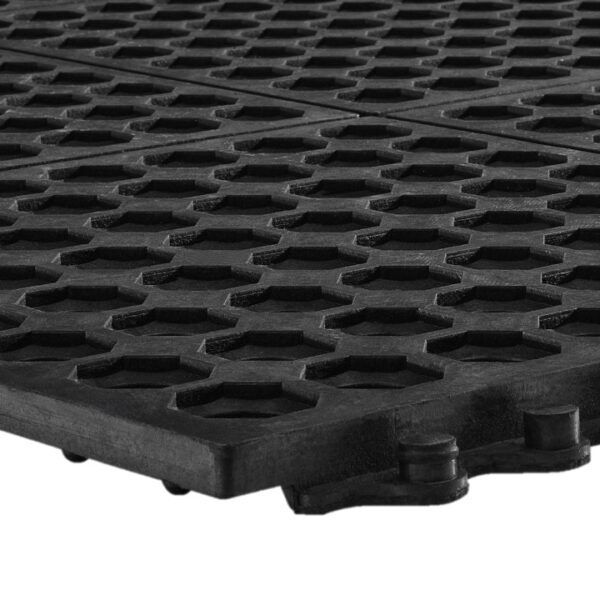 Close-up of the Interlocking Anti-Fatigue Mat in black, featuring a hexagonal and circular pattern that highlights the mat’s textured surface and thickness.
