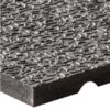 Close-up of the Amoebic Top Stable Mat, a textured grey rectangular mat with a rough, wavy surface and a visible groove on one edge, made from dense, solid material.