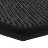 Close-up of the Foam Cushioned Industrial Mat in black, highlighting its textured surface with raised circular bumps arranged in a grid and showing the mat’s edge and thickness.