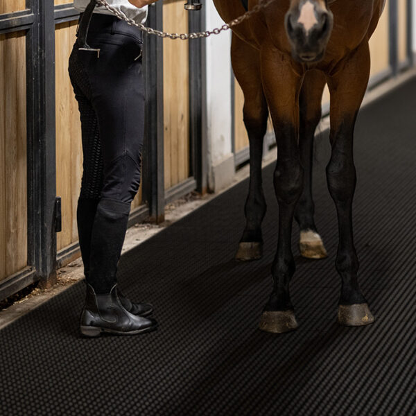 horse stable rubber mat product image|bubble top rubber matting|amoebic top stable mat underside|close up of a bubble top stable mat