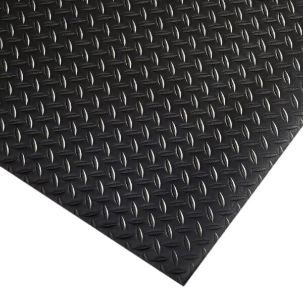 Close-up of the Comfort Plus Anti-Fatigue Mat in black rubber, showcasing a chequer plate pattern with raised, textured diagonal shapes for enhanced slip resistance.