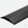 A close-up of the PVC Cable Protector, a black rubber cover with a sloped, ridged surface and internal channels, measuring 17mm high.