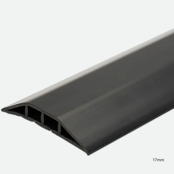 A close-up of the PVC Cable Protector, a black rubber cover with a sloped, ridged surface and internal channels, measuring 17mm high.