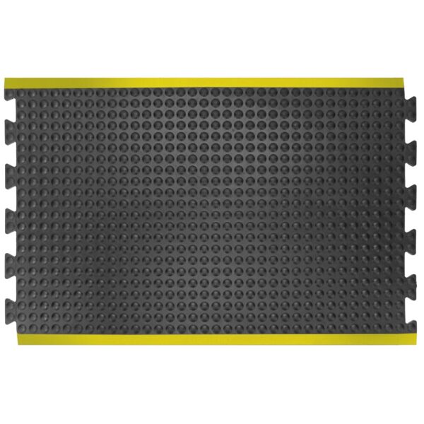 The Interlocking Air Cushioned Mat is a rectangular black floor mat featuring a textured, bubbled surface, interlocking edges, and yellow safety borders on two opposite sides.