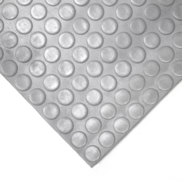A close-up of the Circular Stud Matting Roll in grey, featuring a raised circular dot pattern, photographed at an angle against a white background.