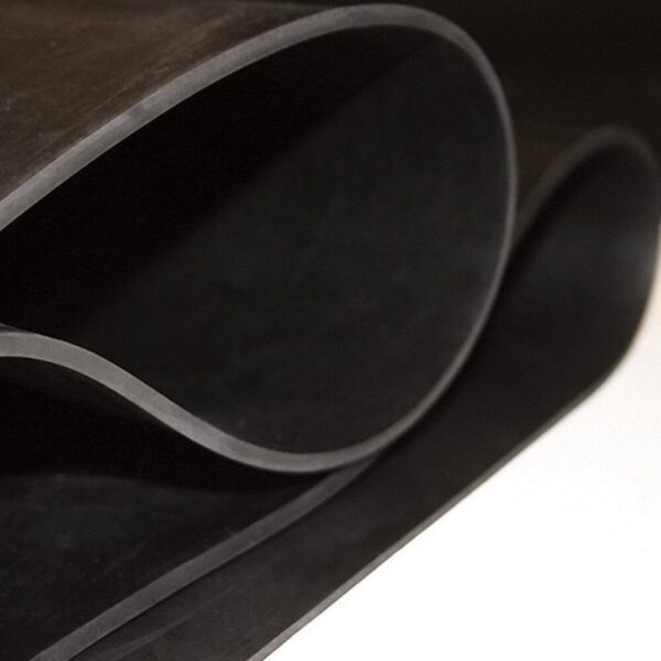 A close-up of Black Commercial Rubber partially rolled, highlighting its smooth, flexible texture and clean edges.