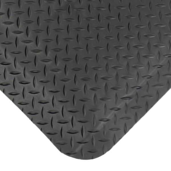 Close-up view of the Premium Anti-Fatigue Mat, featuring a black chequer plate surface with raised oval patterns and a rounded bottom edge.