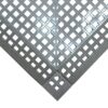 A close-up of Interlocking Anti-Slip Leisure Tile panels joined at a right angle, forming a corner with a chequered pattern of square holes.