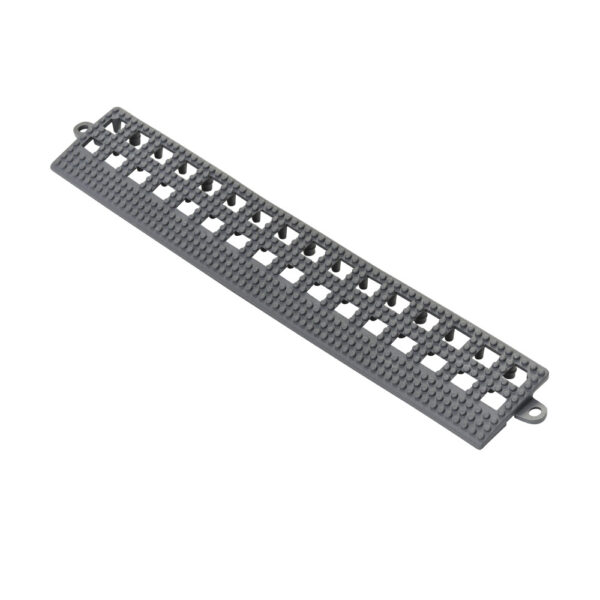 The Interlocking Anti-Slip Leisure Tile Edge is a long, rectangular grey tile with small studs, three rows of evenly spaced square holes, and rounded tabs on both ends for easy connection.