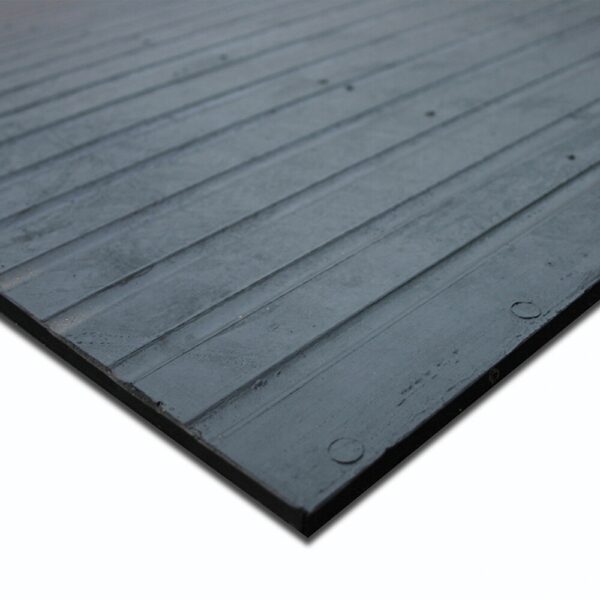 Close-up view of the Heavy-Duty Gym Mat, a black rectangular rubber mat featuring a ribbed texture and circular markings, laid flat on a white background.