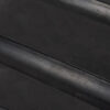Close-up of the Heavy-Duty Gym Mat’s smooth black surface, featuring diagonal parallel raised grooves for enhanced grip.